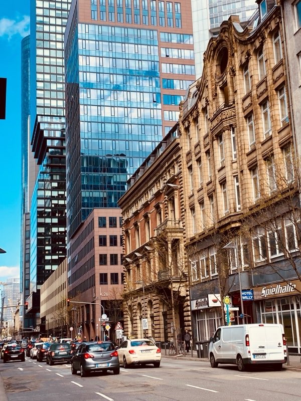 Glass and stone facades along a business avenue