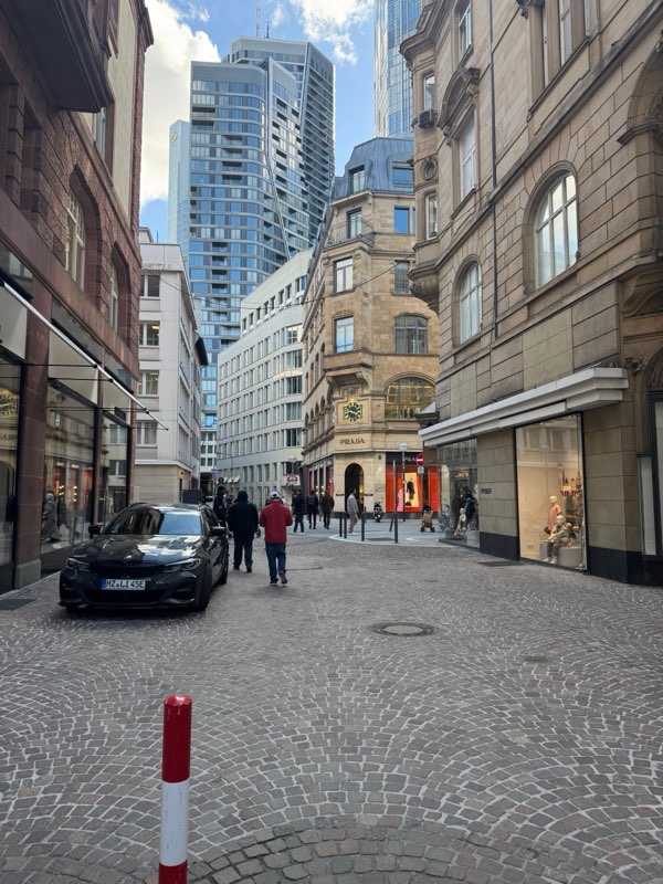 Towers above a cobbled street in the old financial quarter