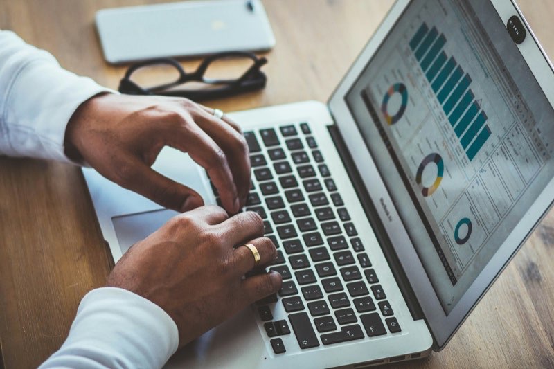 Reviewing portfolio figures on a laptop